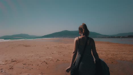 Woman-walking-at-the-beach-in-Slow-Motion-4k