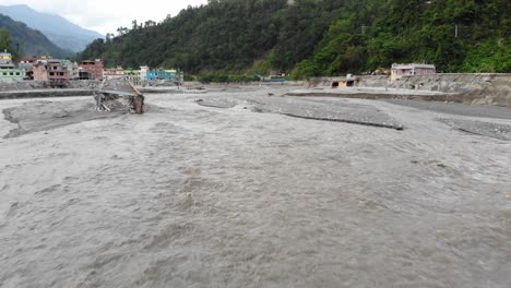 drone footage reveals severe damage in melamchi bazaar, sindhupalchok, where the melamchi river flooded due to extreme weather worsened by global warming—not just rain but rising climate stressors.