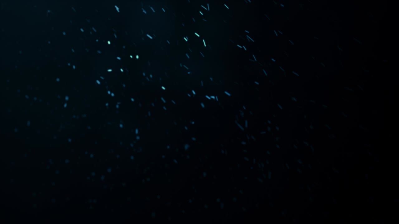 blizzard, abstract composition from chaotic flying sparkles like a snow in a winter with depth of field