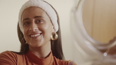 woman smiling during beauty routine