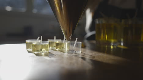 Filling-pots-with-candle-liquid