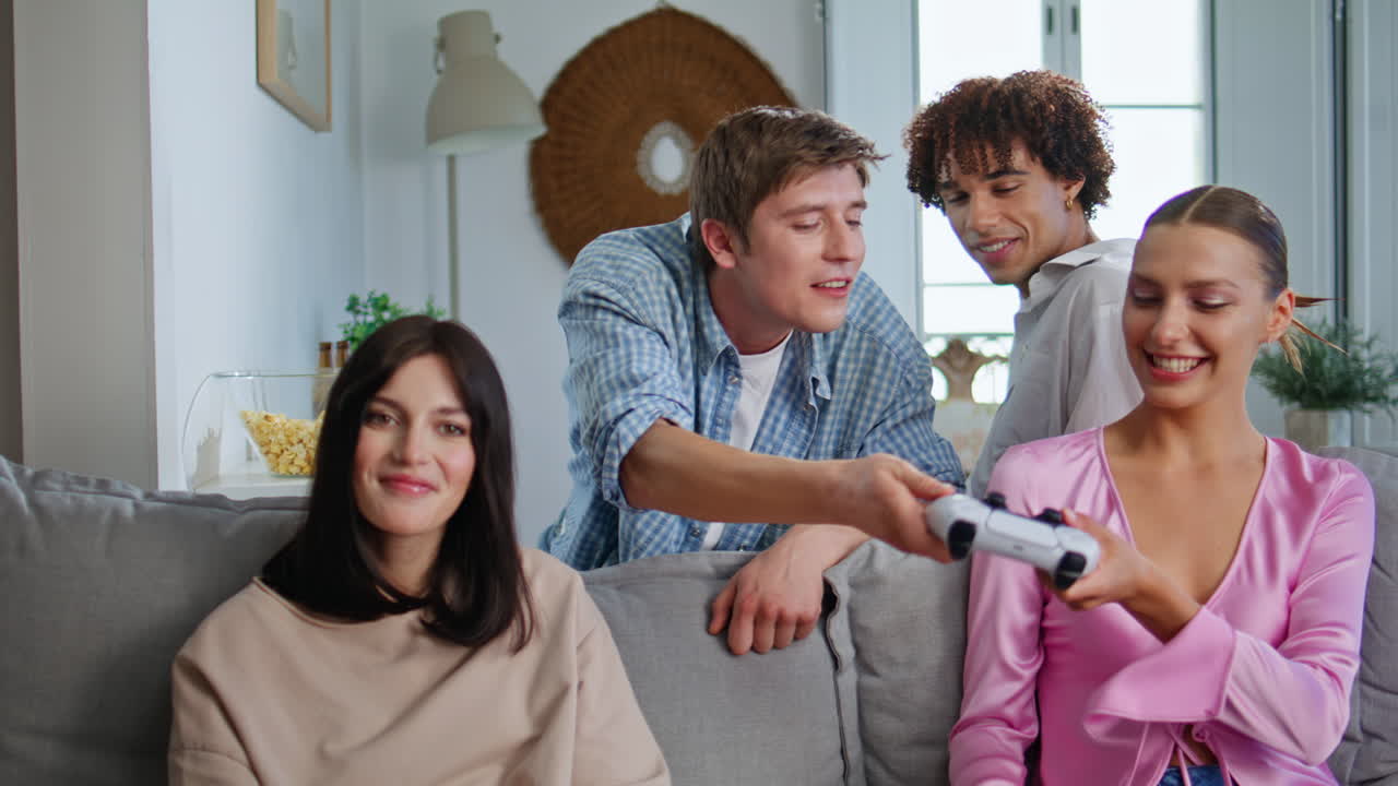 Guys girls competing videogame reacting emotionally home closeup. Gaming friends