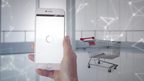 animación de una mano sosteniendo un teléfono inteligente y haciendo compras en línea