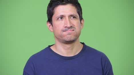 annoyed hispanic man looking bored