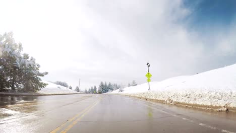 driving on suburban road after the sping snow storm.
