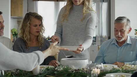 caucasian family sharing the food in christmas eve.