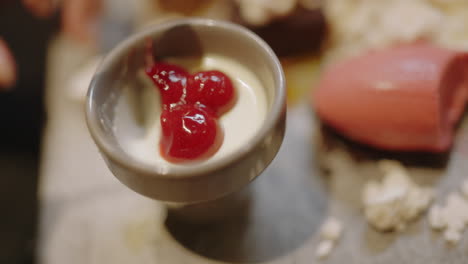 experience the allure of asian fusion cuisine with this close-up of a delicious dessert being scooped by a spoon