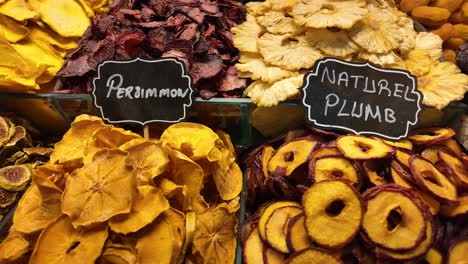 vibrant assortment of dried fruits at a market stall