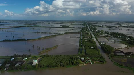 Aerial-tracking-view-of-colorful-Mekong-Delta-afternoon-over-agricultural-land-and-waterways-in-Vietnam-1
