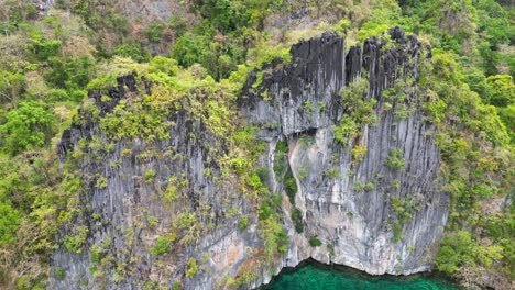 sheer mountain cliffs of el nido in palawan, jagged tropical grey rocks