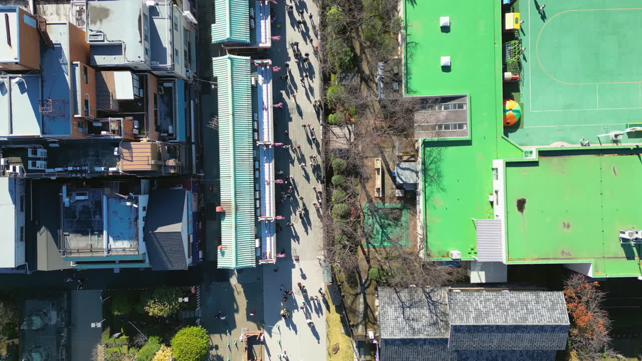 Top down drone shot over the Sensō-ji temple in Asakusa, Tokyo, sunny, fall day