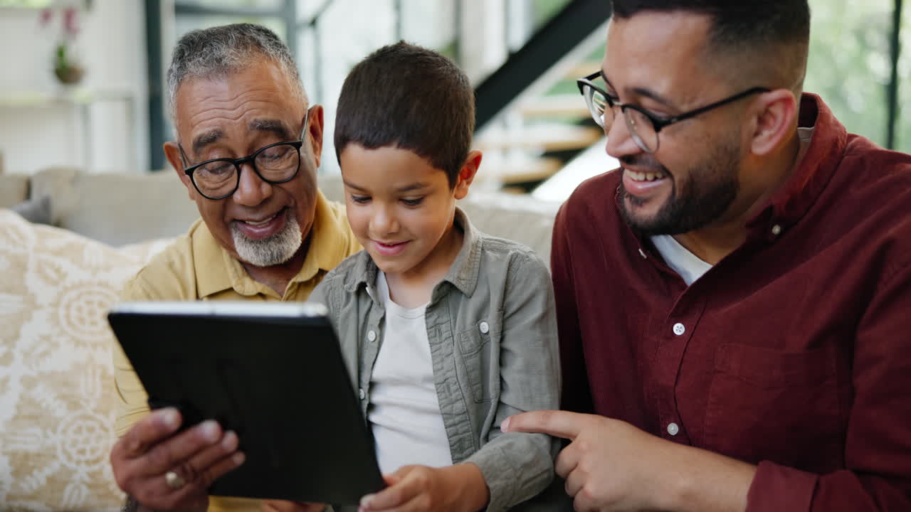 Grandfather, Father, and Grandson Enjoying Tablet Together