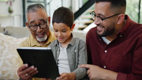 grandfather, father, and grandson enjoying tablet together