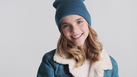 teenage caucasian girl wearing denim jacket and gesturing.