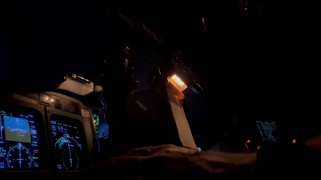 Close view of the flight controls column during a night flight ...