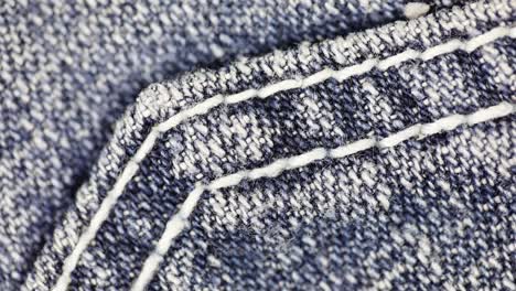 blue denim jeans texture - jeans background, top view, closeup