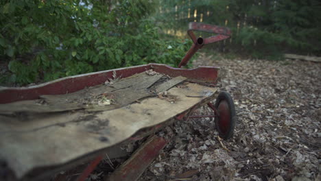 wrap around an old broken child's red wagon