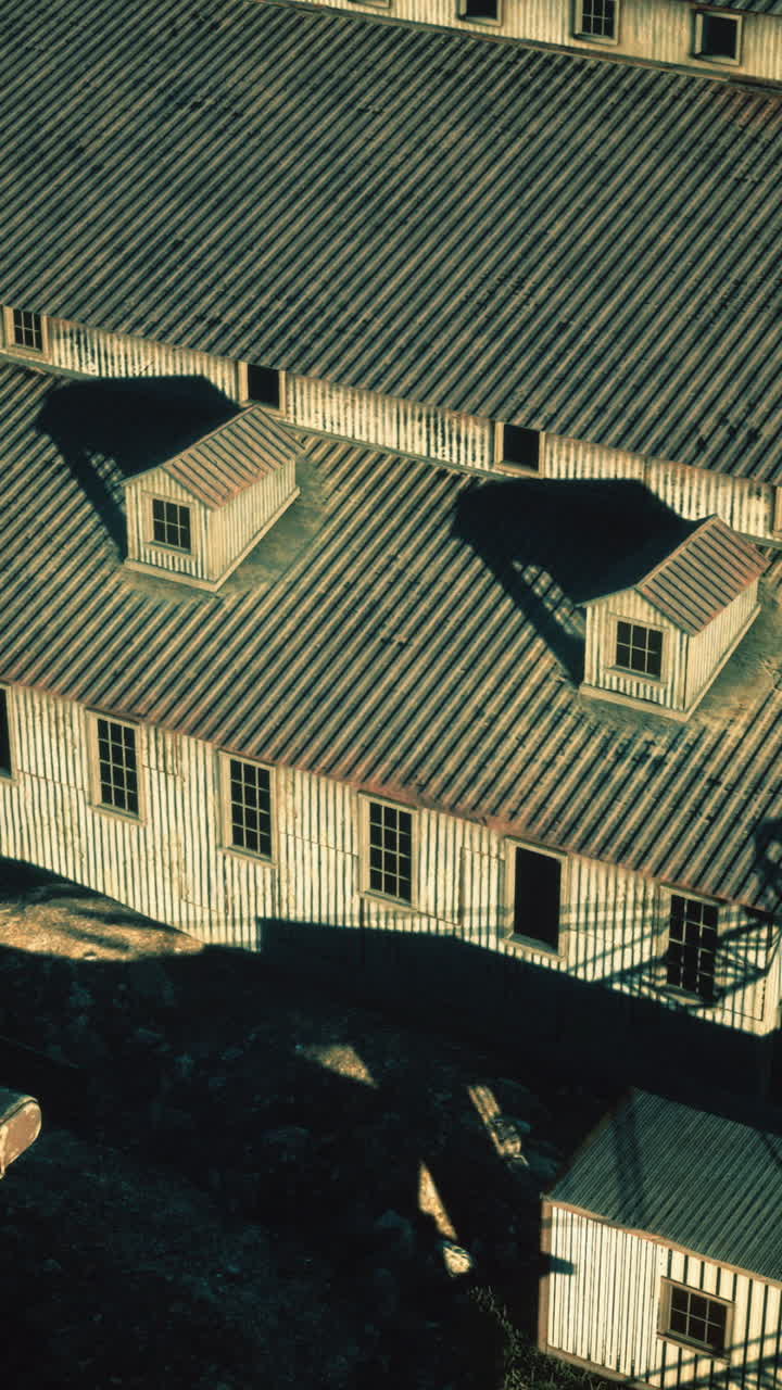 Historic warehouse stands resilient in the golden glow of sunset