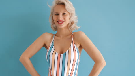 smiling woman in a striped swimsuit