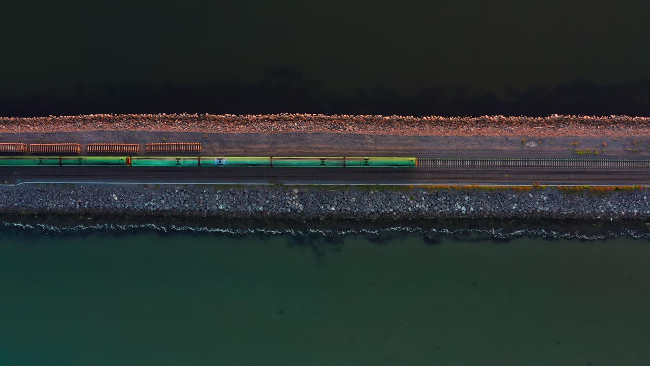Aerial Top-Down View of Irish Dart Crossing Broadmeadow Viaduct in the Evening