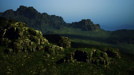 landscape of rugged mountains under soft evening light