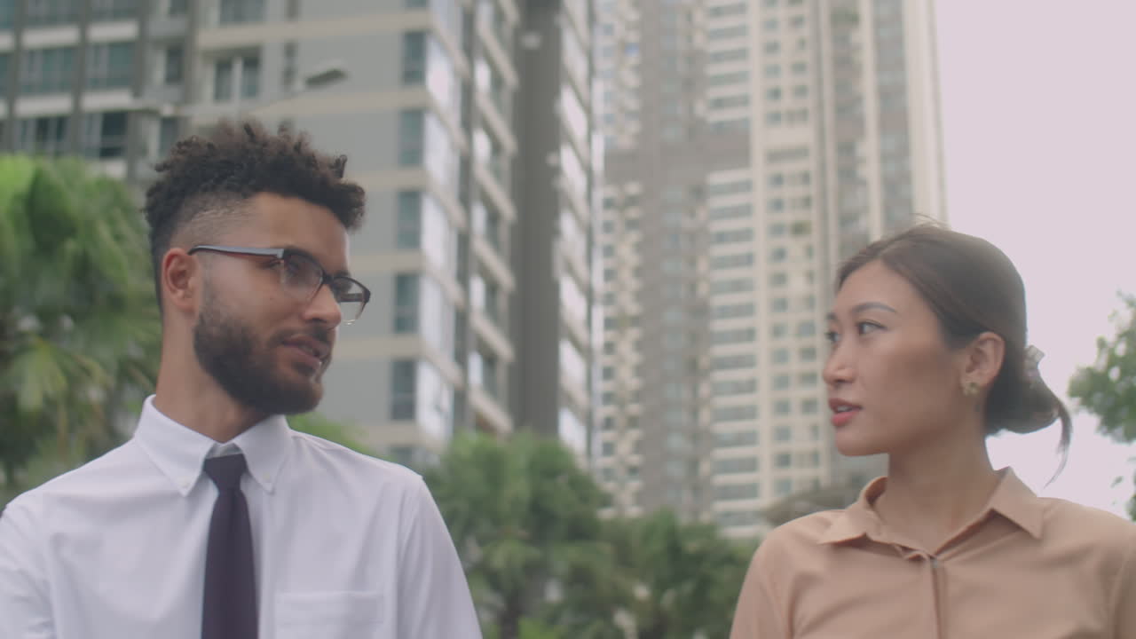Colleagues Walking on Street and Chatting