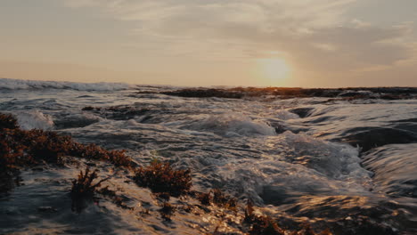 sunset waves on rocky coast