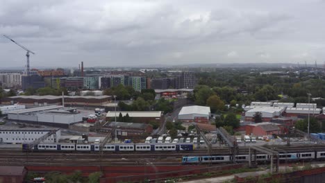 drone shot tracking train near manchester piccadilly station 07