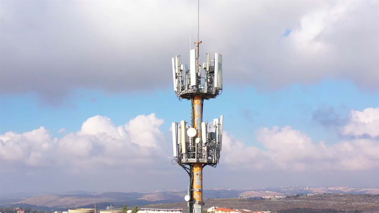 Aerial footage Close to cellular Antenna with blue sky and Clouds