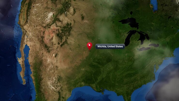 Satellite view zooms from outer space directly toward Wichita, Kansas, with a location pin marker. Includes NASA public domain imagery.