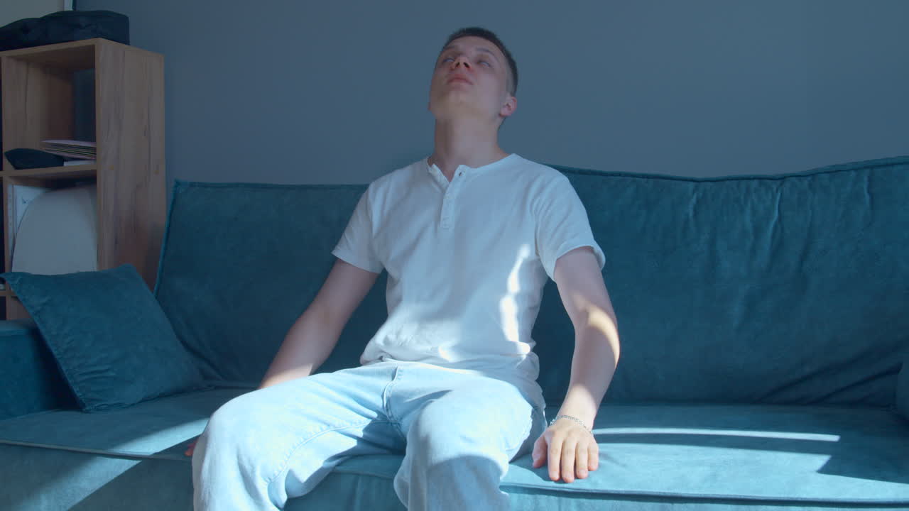 Young Man Relaxing on a Couch