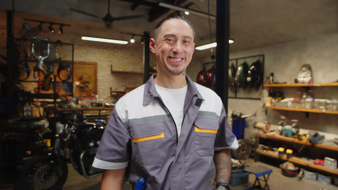 Portrait of Multiethnic Repairman in Motorcycle Garage