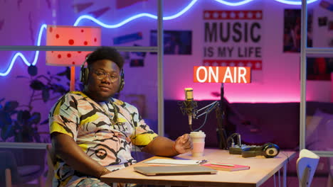 dj in a colorful night studio