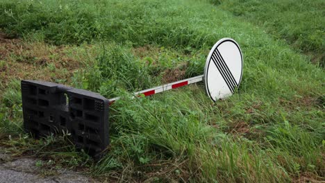 Slow-orbit-around-fallen-red-white-sign-post-for-national-speed-limit