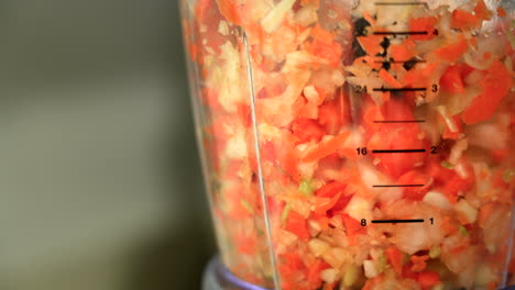 Food-processor-is-mixing-vegetables-at-high-speed