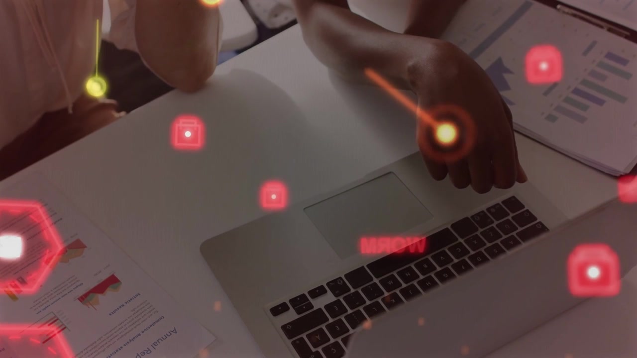Two colleagues pointing at laptop and touching charts, causing animated red nodes during analysis