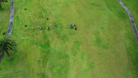 cinematic aerial drone shot of green golf course