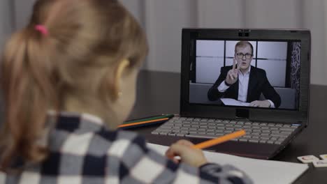 children pupil distance education on laptop. online lesson at home with teacher