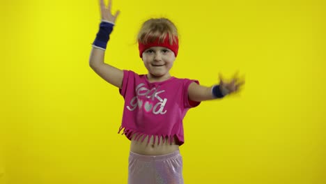 Little-energetic-caucasian-girl-in-pink-sportswear-making-fit-dance,-modern-aerobic-dancer