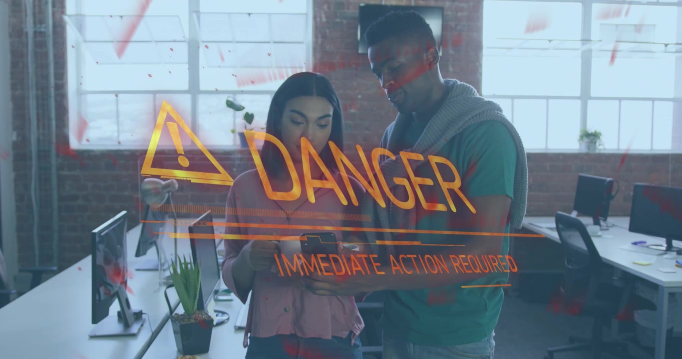Animation of danger text over diverse business people in office