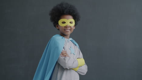 child dressed as superhero