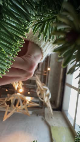 looking up at a christmas tree decorated in an interior