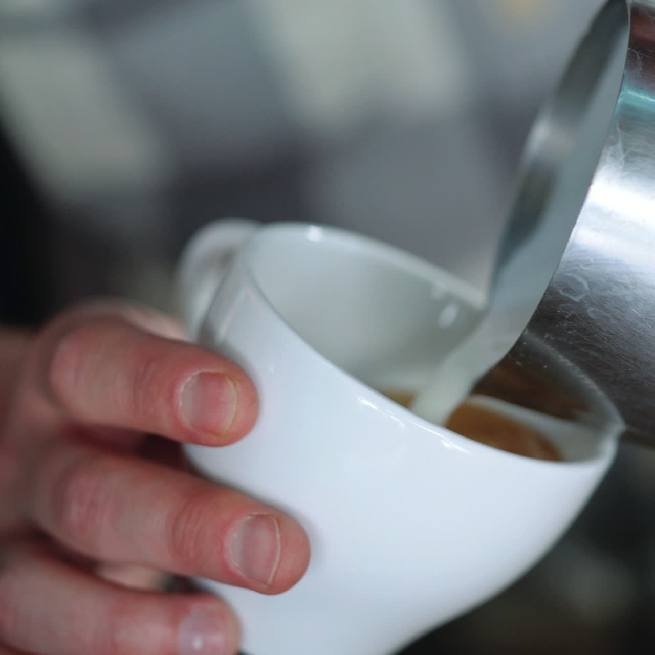 Barista drawing the heart on the coffee. Concept of services and beverages. Sqare video