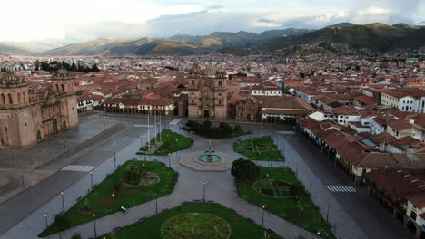 Daytime-4k-aerial-footage-of-Plaza-de-Armas-in-Cusco-City,-Peru-during-Coronavirus-quarantine,-left-to-right-truck-and-pan,-wide-angle-shot