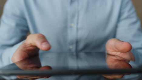 Man hands working tablet close up. Unknown businessman holding tab computer.