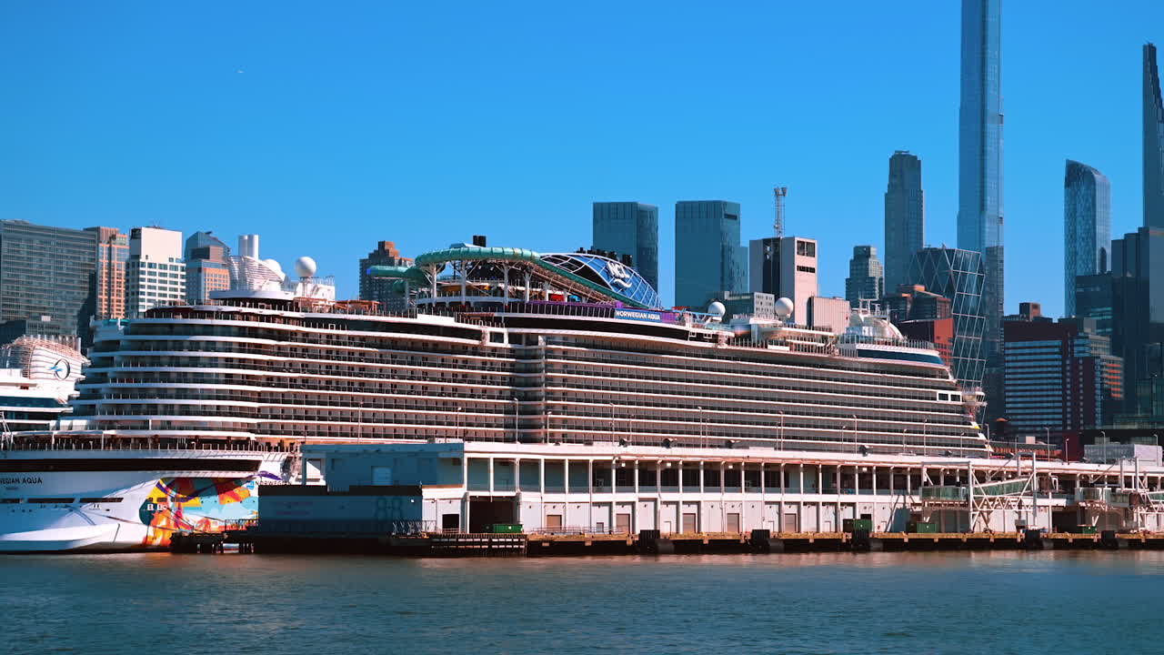 New York, USA, 9 August 2025: Large cruise ship docked in Manhattan Harbor, New York City. Massive cruise liner docked in Manhattan Harbor with modern skyscrapers of New York City in the background