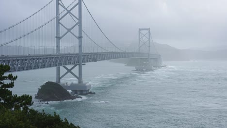 typhoon hits onaruto bridge in shikoku japan