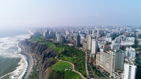 endless skyline of busy lima, capital of peru, aerial along the coastline slowmo