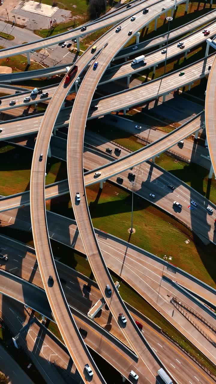 Freeways crossing in Dallas, Texas, USA. Top view on the cars going by the roads at daytime
