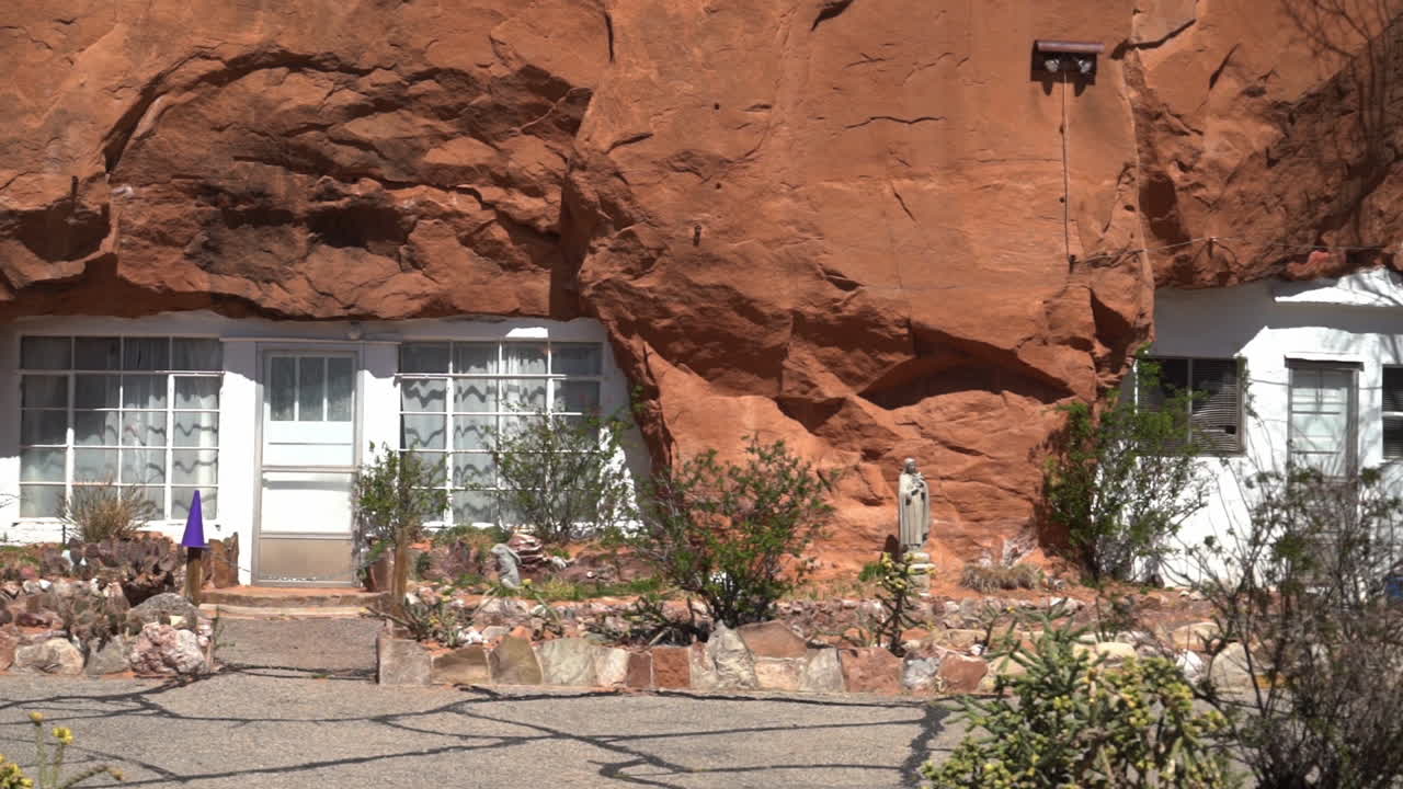 Homes Carved Out of Sandstone Cliff, Hole N'' The Rock Tourist Attraction Near Moab, Utah USA